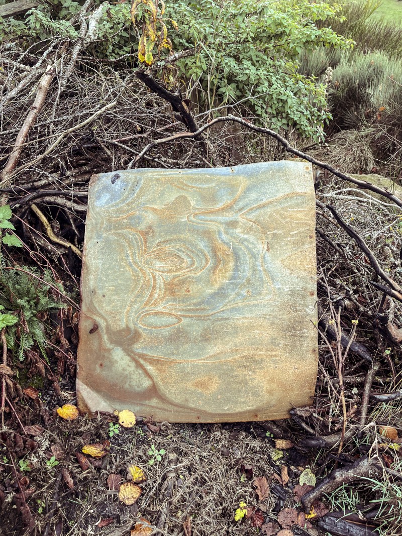 metal plate in a field